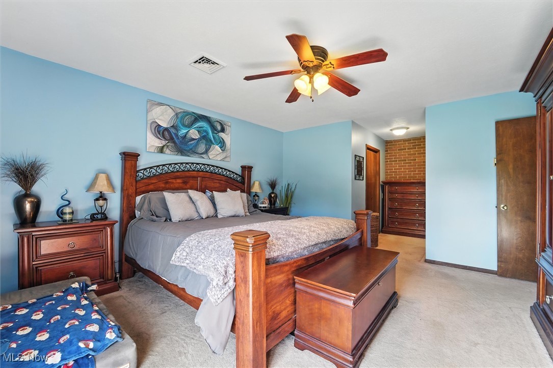 12120 Caves Road Chesterland, OH 44026 - Photo 27 of 50 Bedroom featuring a ceiling fan and light carpet