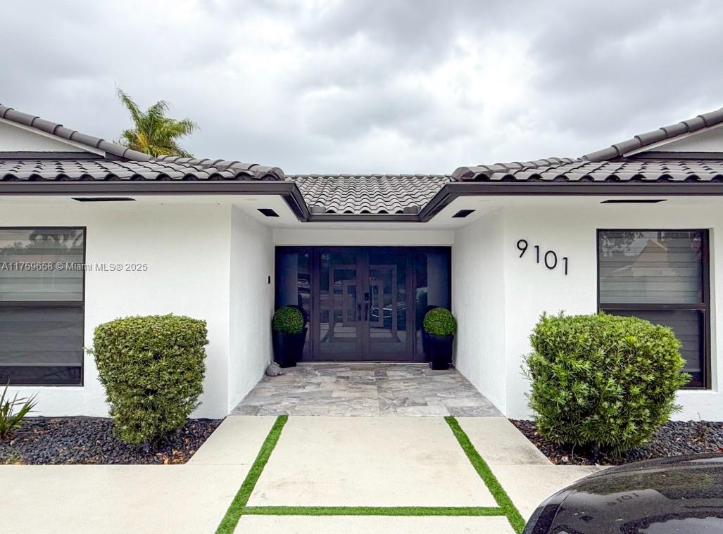 9101 Southwest 11th Street Miami, FL 33174 - Photo 1 of 25 a front view of a house