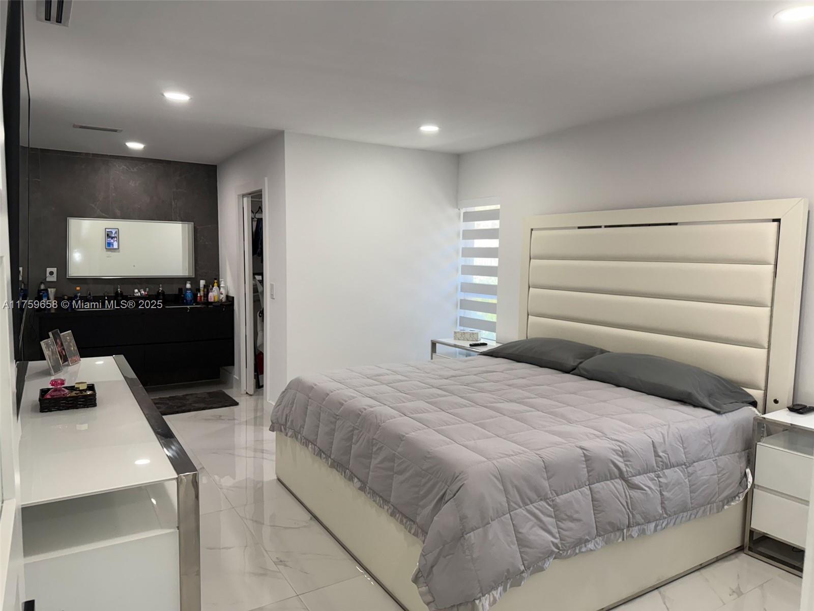 9101 Southwest 11th Street Miami, FL 33174 - Photo 15 of 25 a bedroom with a bed and a flat screen tv