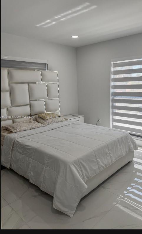 9101 Southwest 11th Street Miami, FL 33174 - Photo 17 of 25 a bedroom with a bed and a night stand