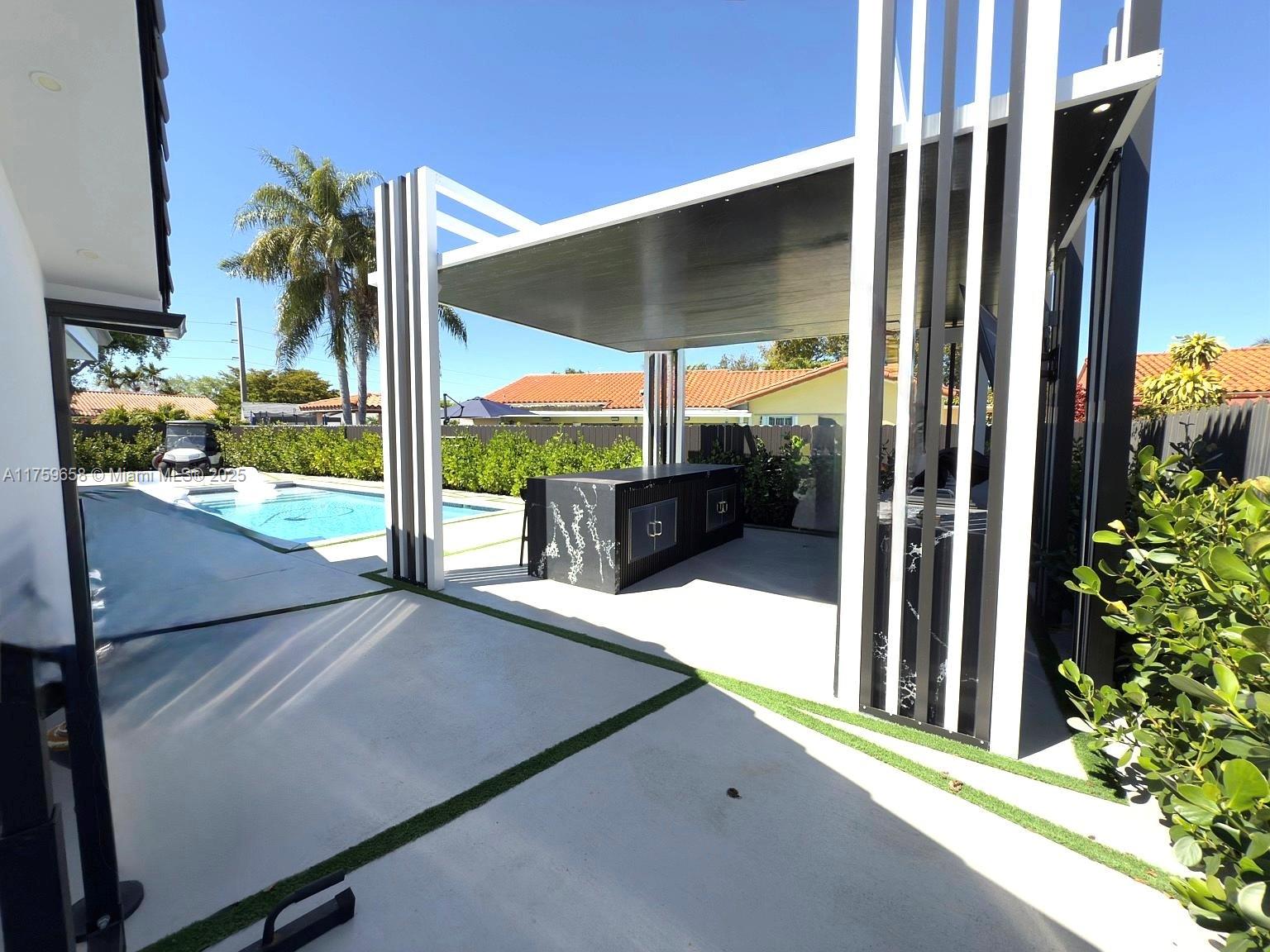 9101 Southwest 11th Street Miami, FL 33174 - Photo 21 of 25 a view of a balcony door and porch with furniture