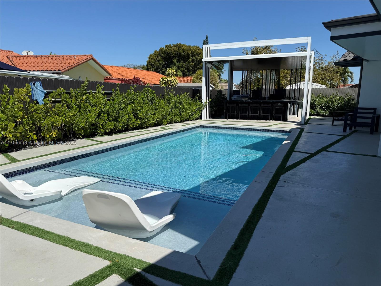 9101 Southwest 11th Street Miami, FL 33174 - Photo 22 of 25 a view of outdoor space and swimming pool