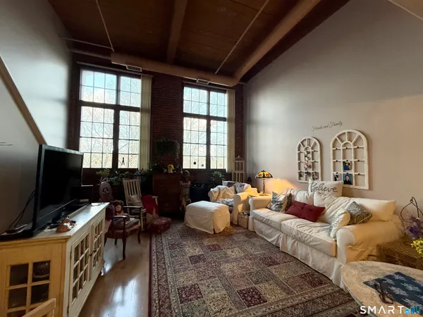 a living room with furniture and a flat screen tv
