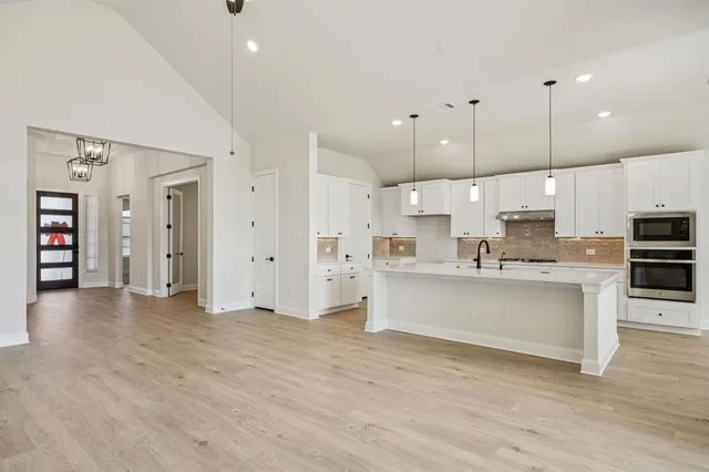 a view of kitchen with wooden floor