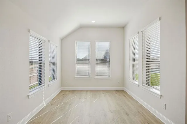 a view of an empty room with a window