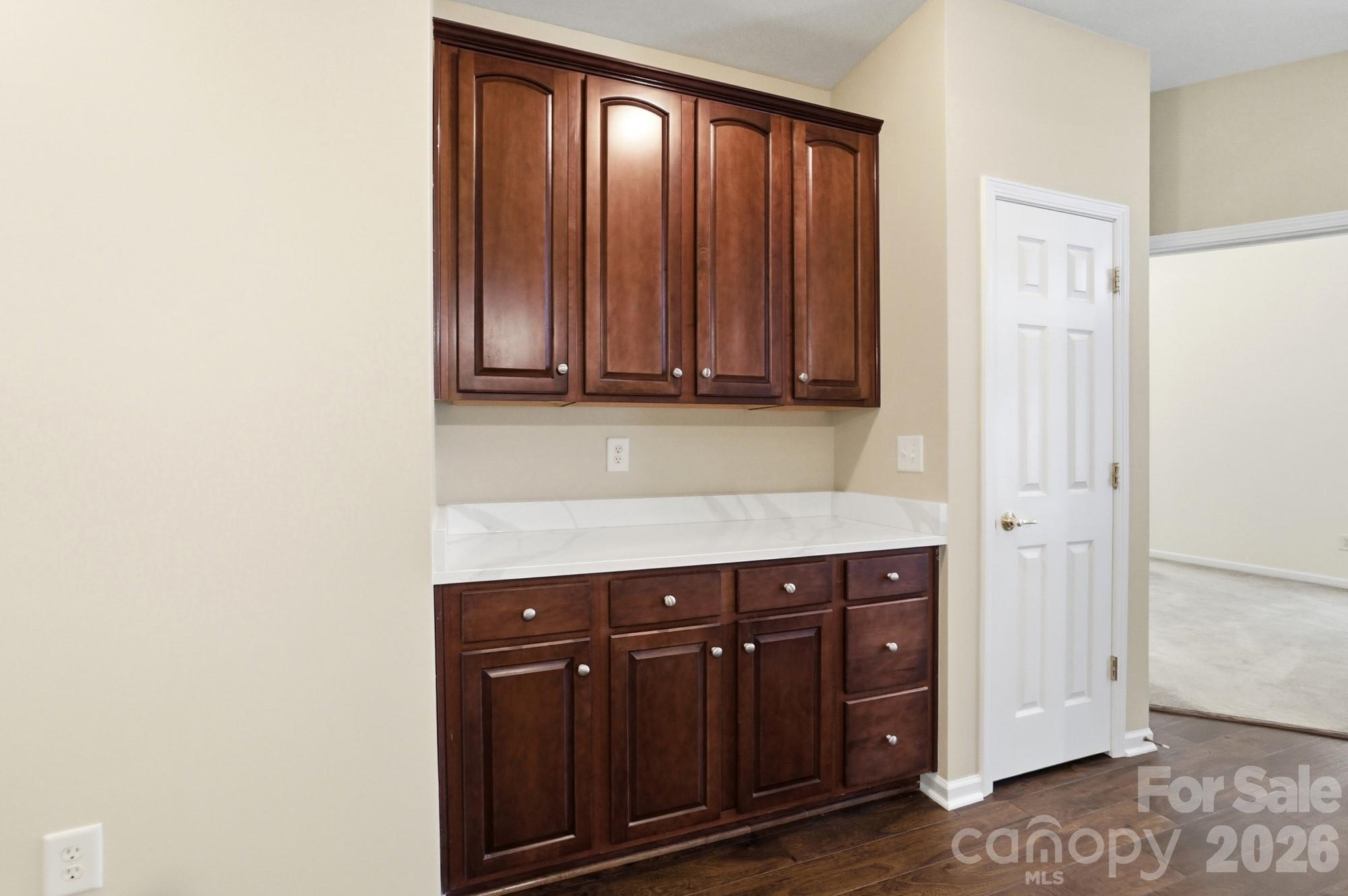 284 Garnet Court Fort Mill, SC 29708 - Photo 14 of 42 a view of a kitchen with wooden cabinets