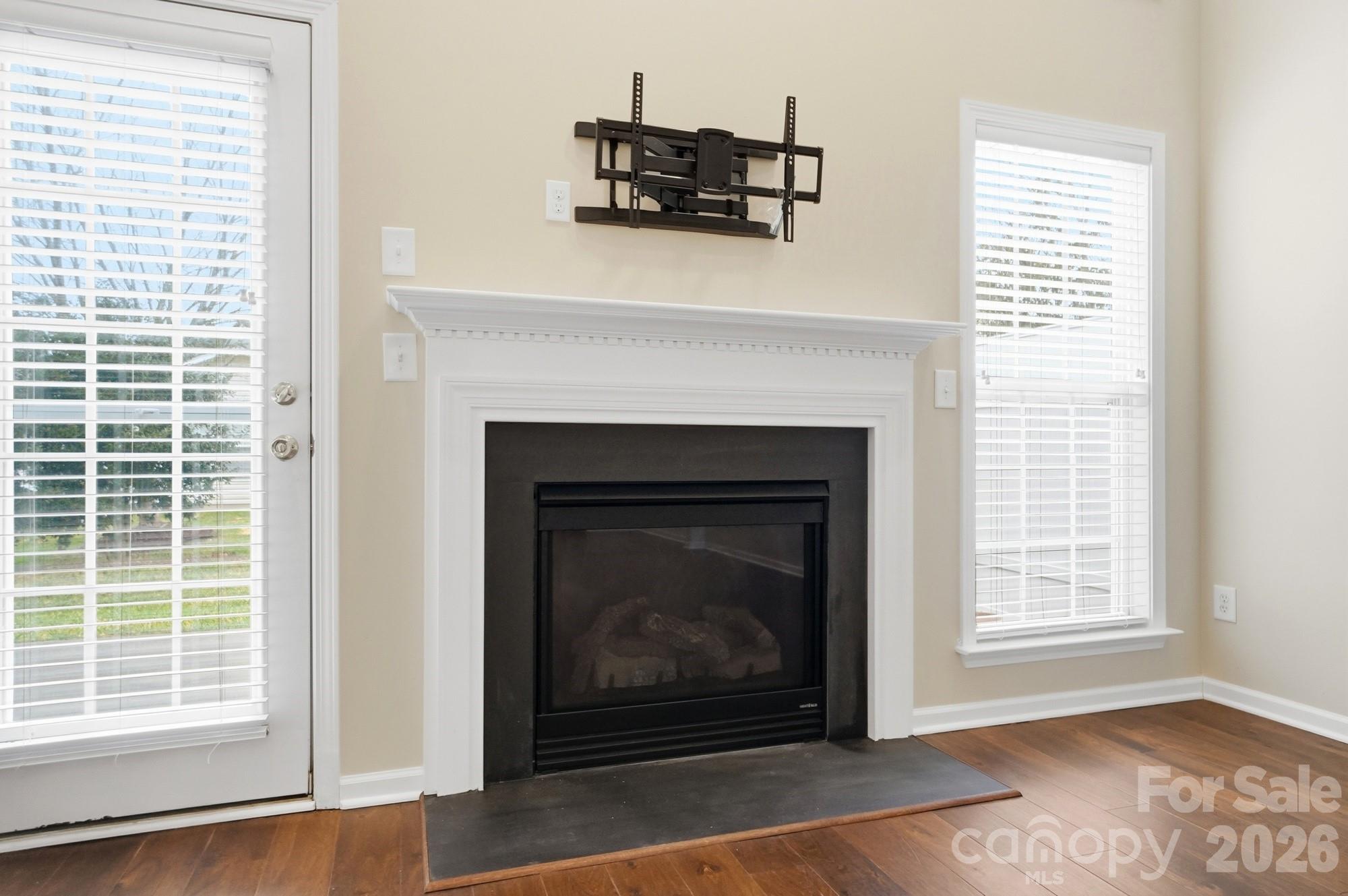 284 Garnet Court Fort Mill, SC 29708 - Photo 17 of 42 a living room with a fireplace and a table