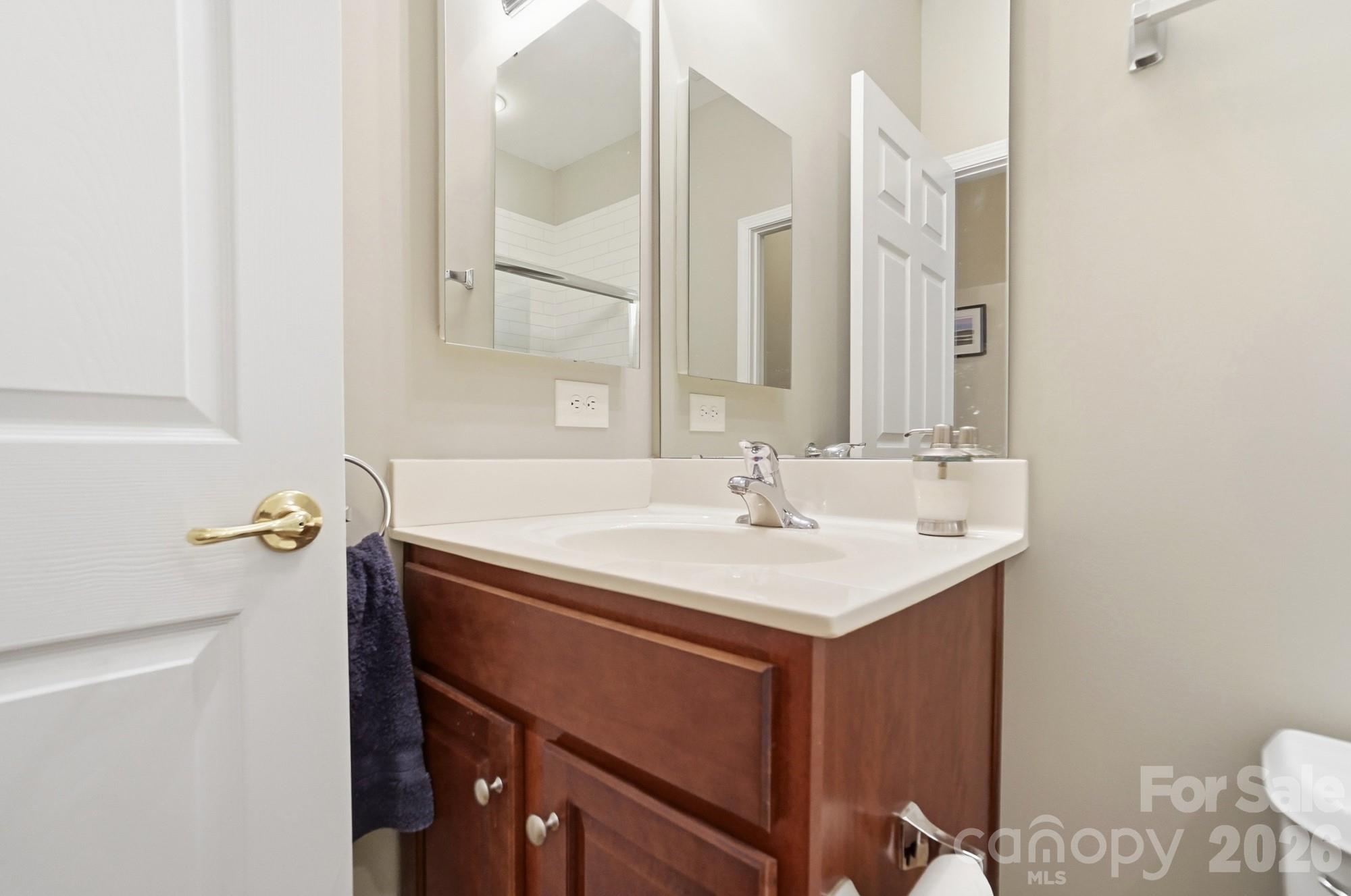 284 Garnet Court Fort Mill, SC 29708 - Photo 26 of 42 a bathroom with a sink and a mirror