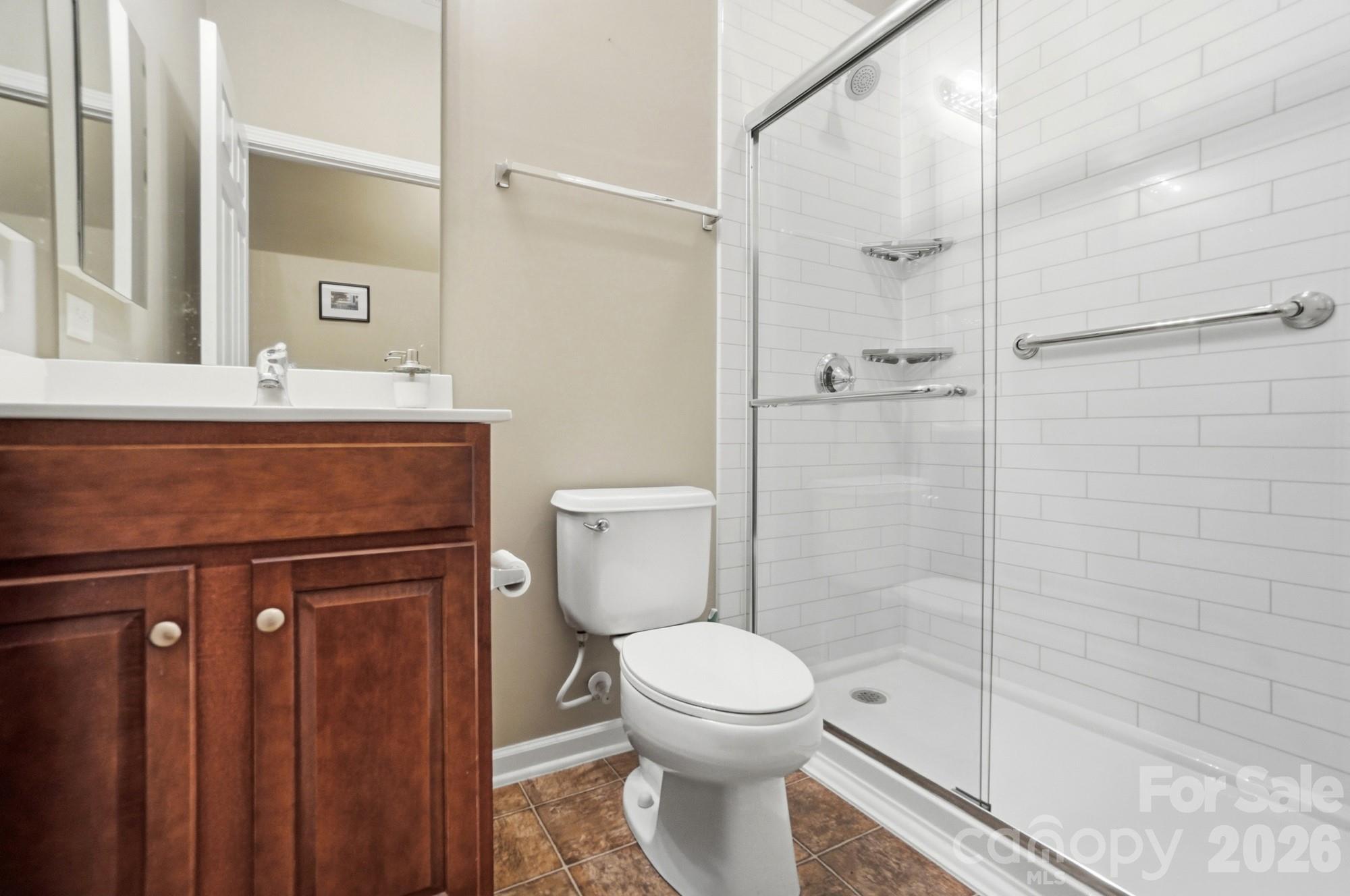 284 Garnet Court Fort Mill, SC 29708 - Photo 27 of 42 a bathroom with a shower a toilet and a sink