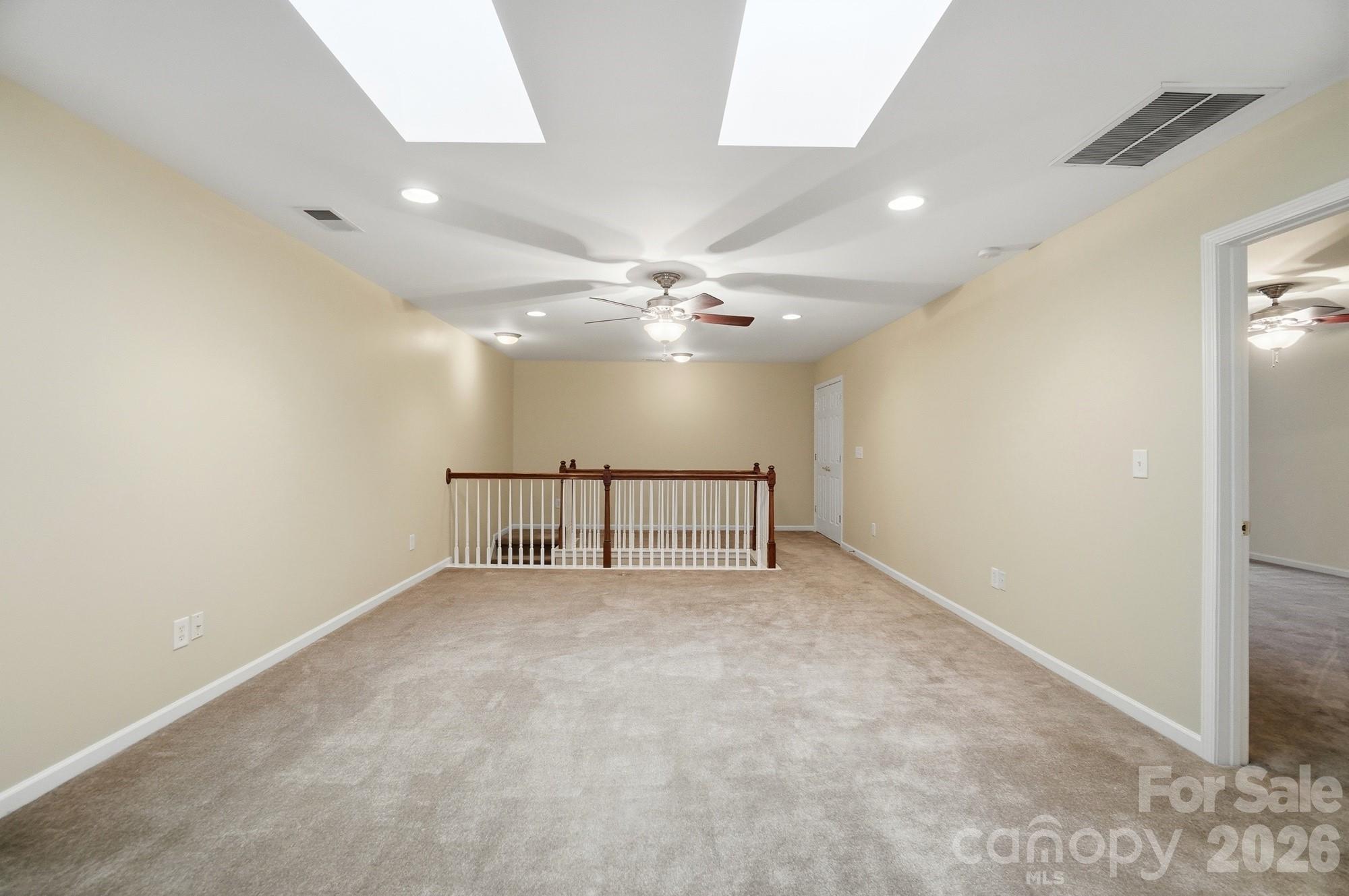 284 Garnet Court Fort Mill, SC 29708 - Photo 34 of 42 an empty room with windows and fan