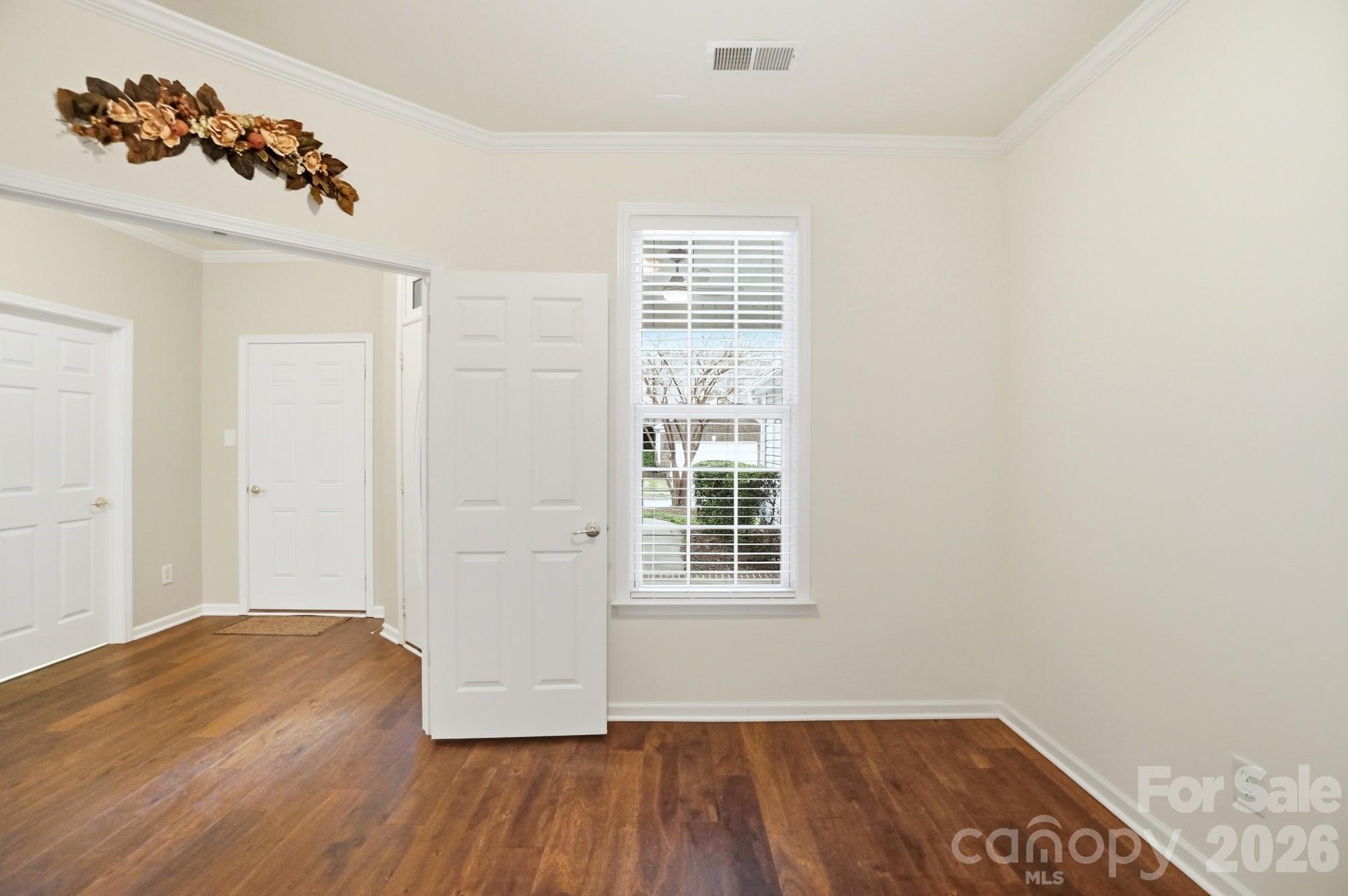 284 Garnet Court Fort Mill, SC 29708 - Photo 5 of 42 an empty room with wooden floor and windows