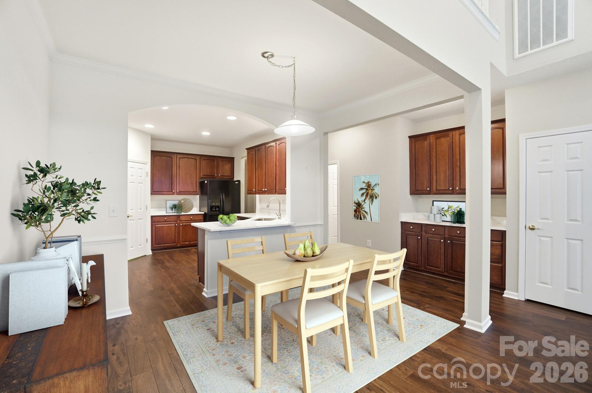 284 Garnet Court Fort Mill, SC 29708 - Photo 10 of 42 a view of a dining room with furniture and wooden floor