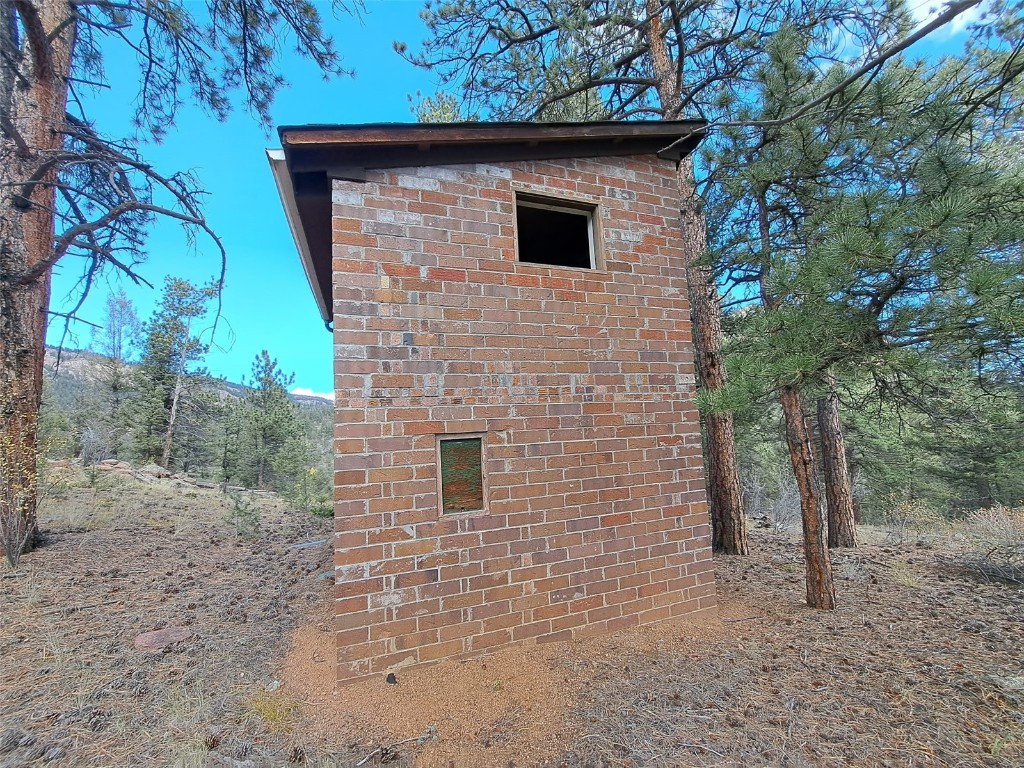 1077 Roland Drive Bailey, CO 80421 - Photo 5 of 17 a view of a wooden door of a house