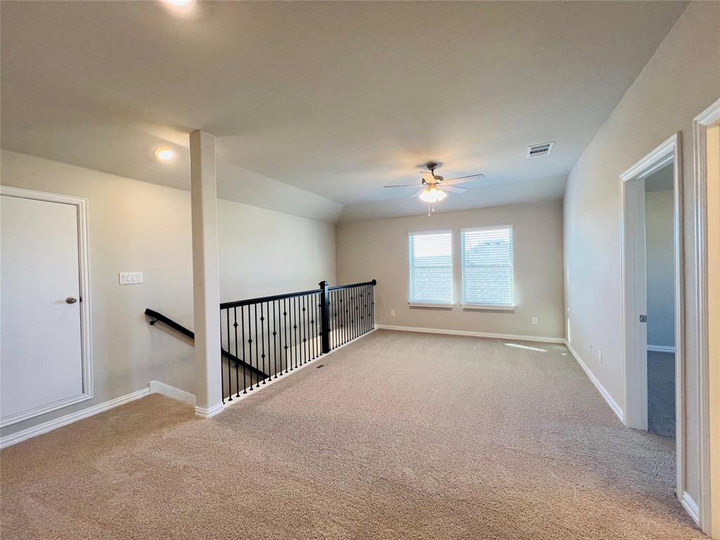 3305 Cross Shr Drive Anna, TX 75409 - Photo 26 of 31 Carpeted empty room with ceiling fan and lofted ceiling
