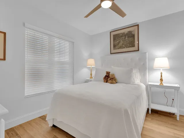 a bedroom with a bed and a lamp