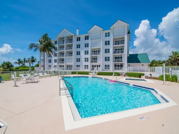 a view of swimming pool from a outdoor seating