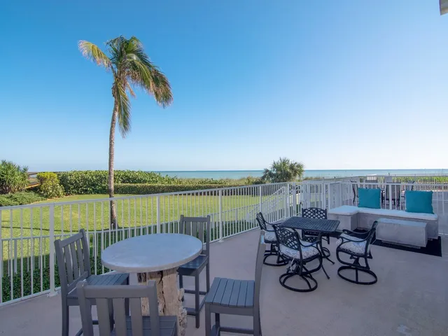 a view of a chairs and table on the terrace