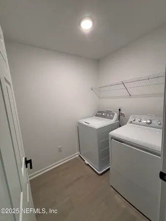 a utility room with dryer and washer