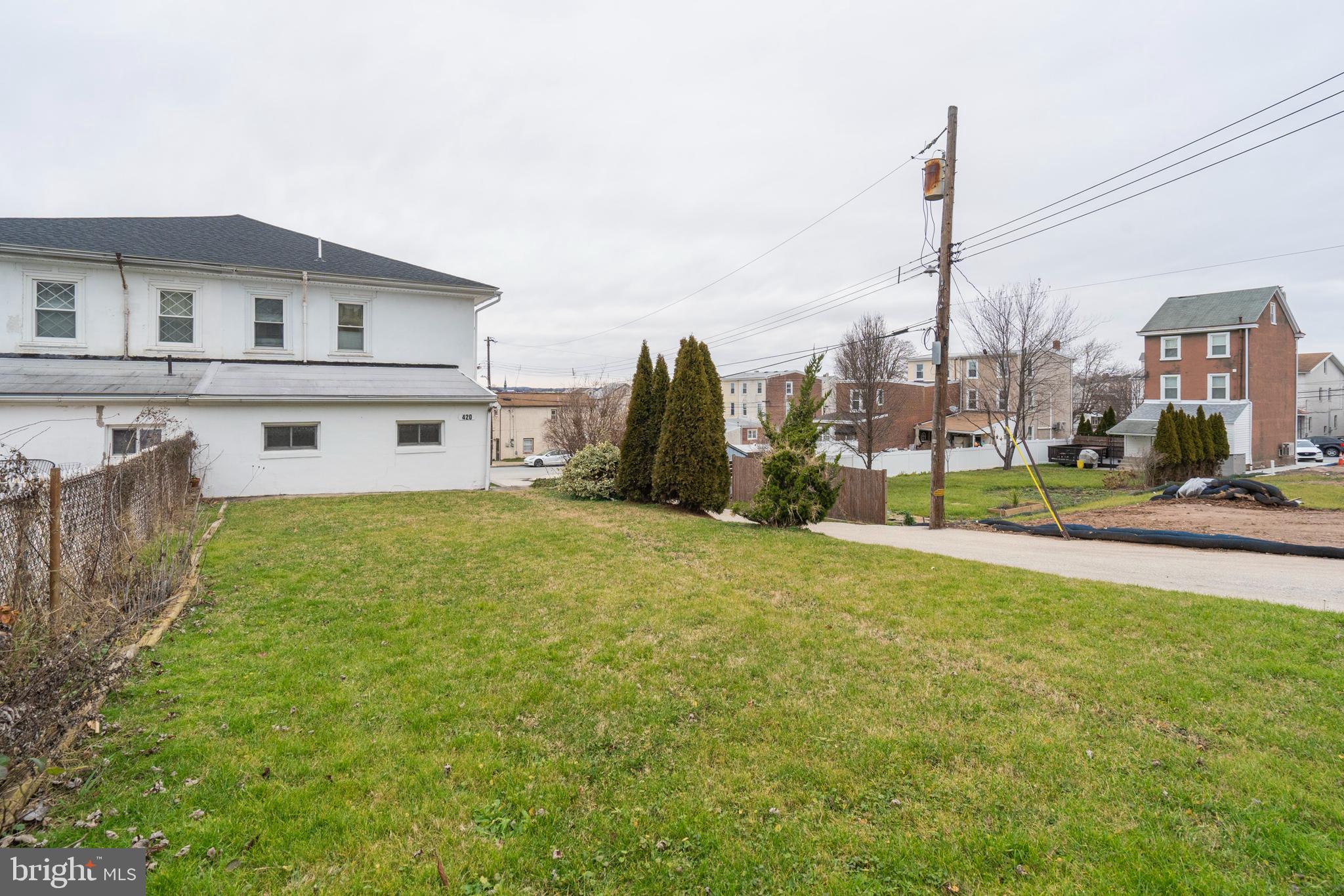 420 Prospect Avenue, Unit 1 Bridgeport, PA 19405 - Photo 22 of 24 a front view of a building with a garden and plants