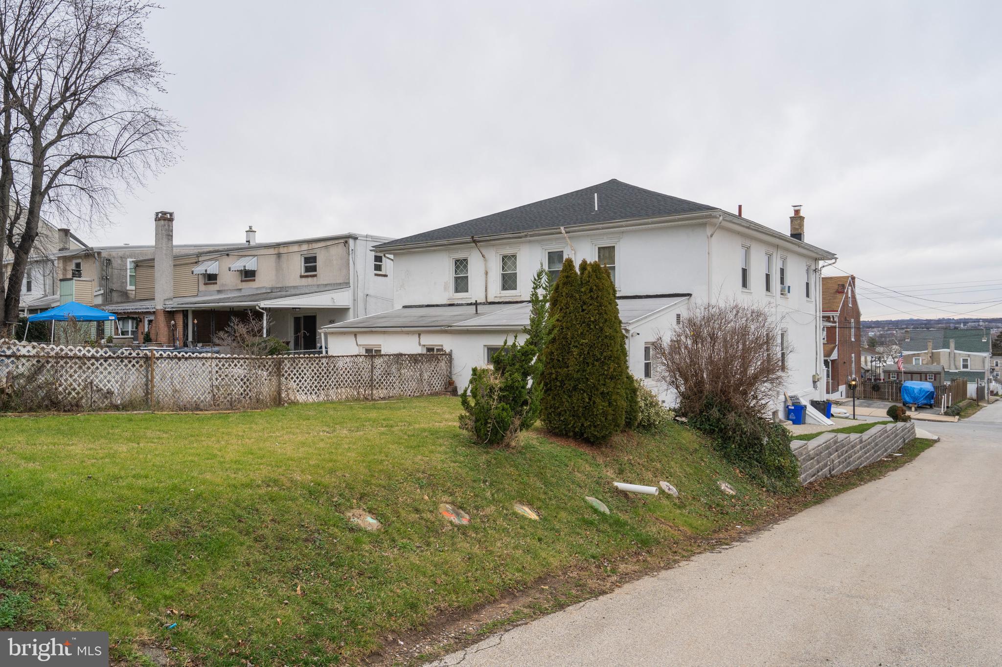 420 Prospect Avenue, Unit 1 Bridgeport, PA 19405 - Photo 23 of 24 a view of a house with a yard and sitting area