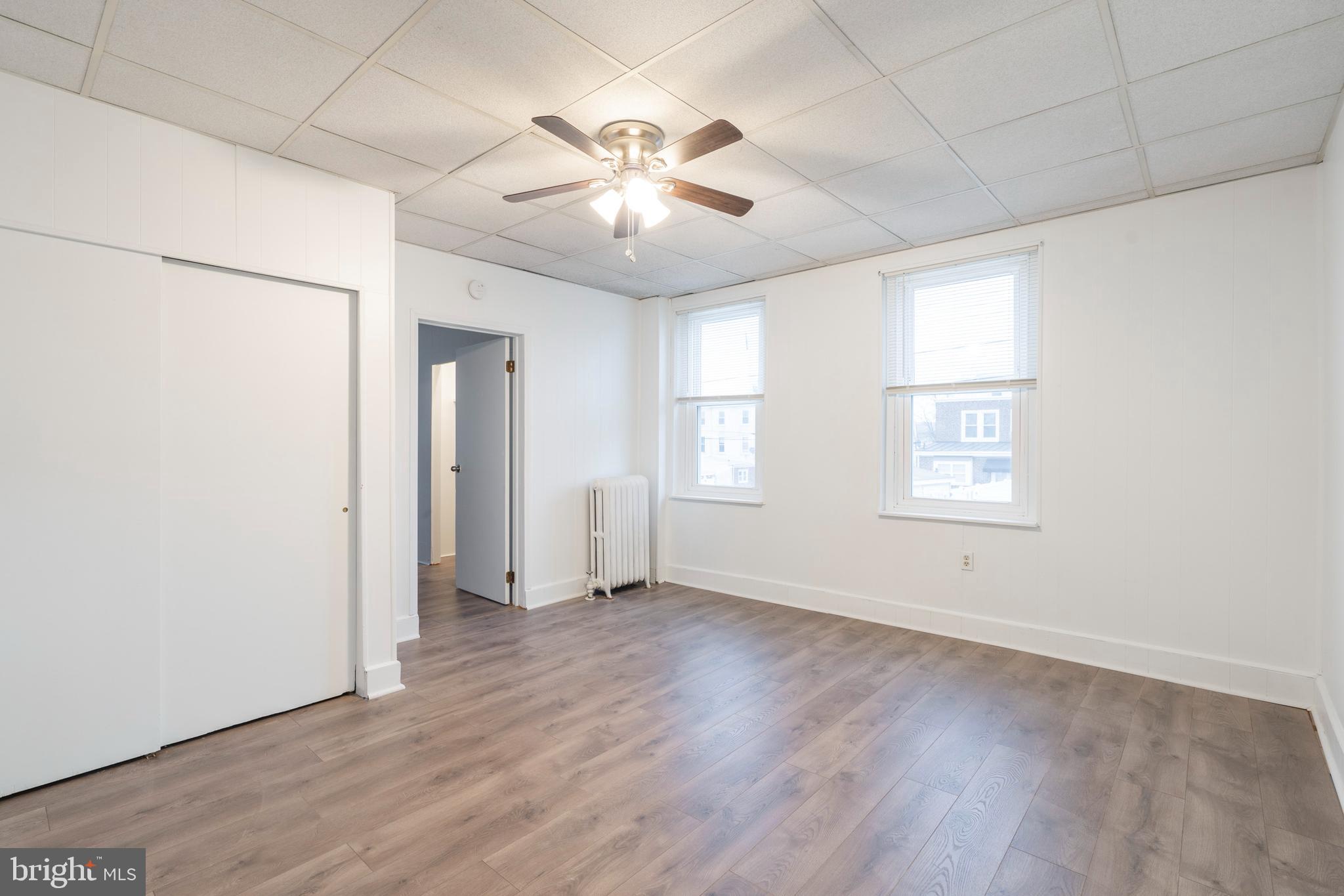 420 Prospect Avenue, Unit 1 Bridgeport, PA 19405 - Photo 10 of 24 wooden floor in an empty room with a window