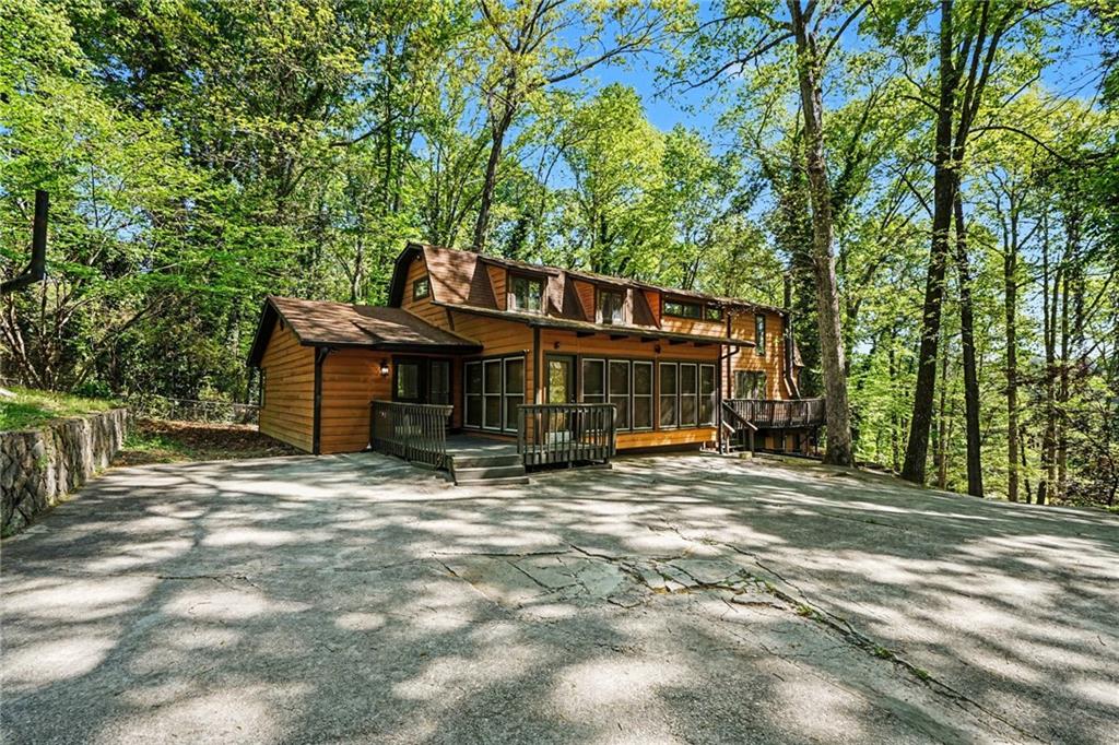 2530 Rockbridge Road Northwest Conyers, GA 30012 - Photo 2 of 45 a view of a house with backyard and sitting area