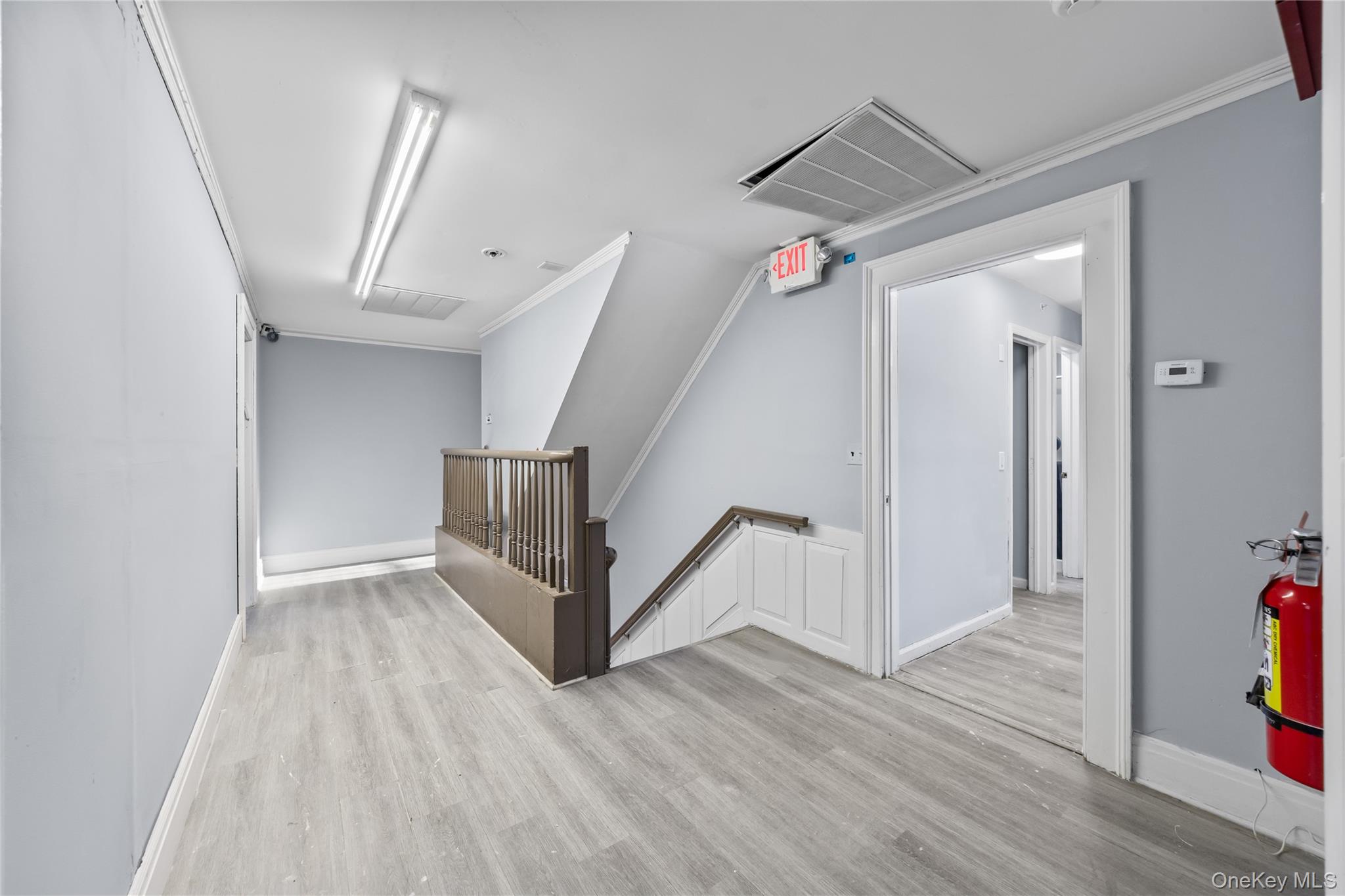 996 Haverstraw Road Suffern, NY 10901 - Photo 19 of 50 a view of a hallway with wooden floor and stairs