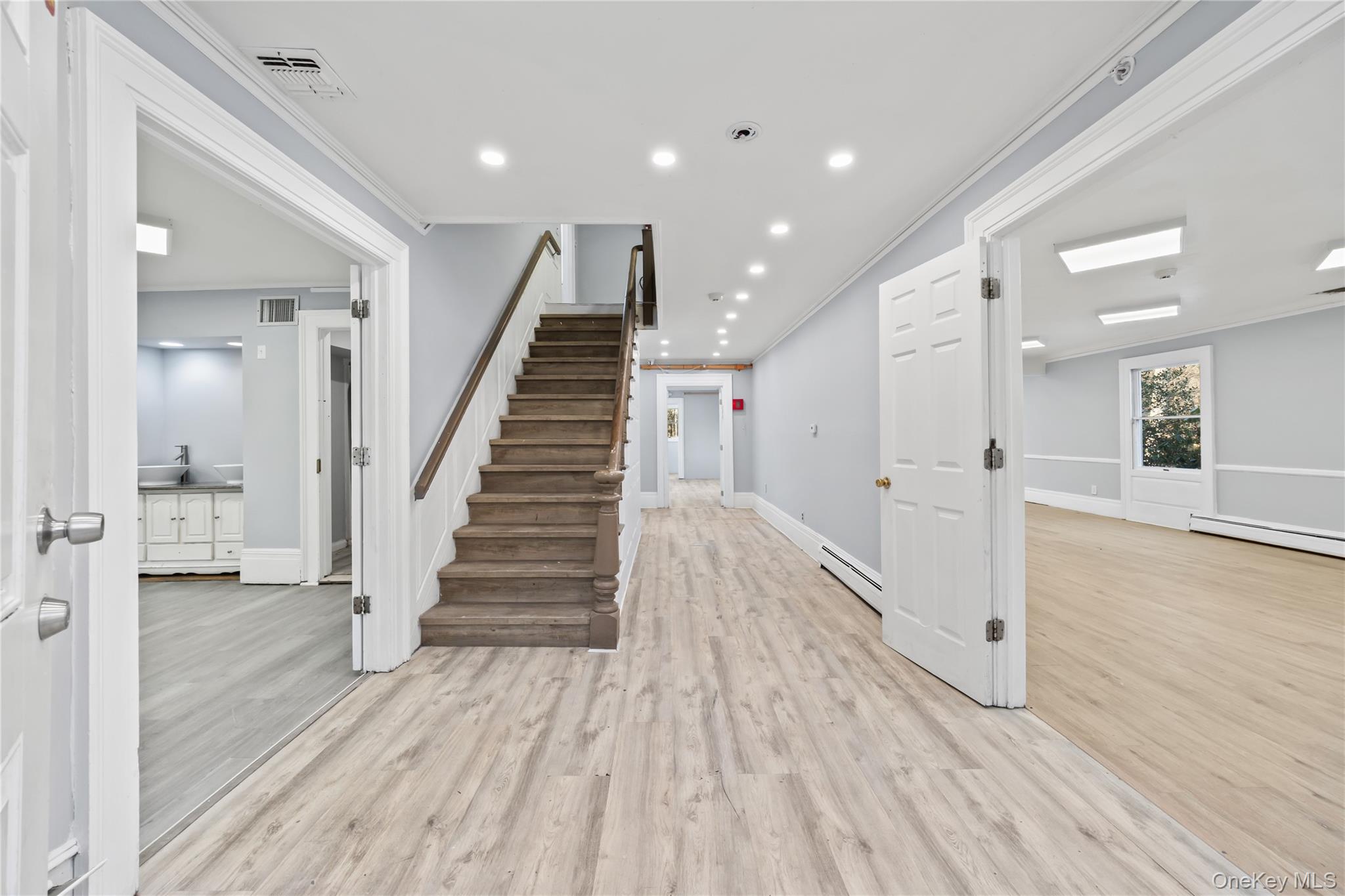 996 Haverstraw Road Suffern, NY 10901 - Photo 10 of 50 a view of a hallway with wooden floor and staircase