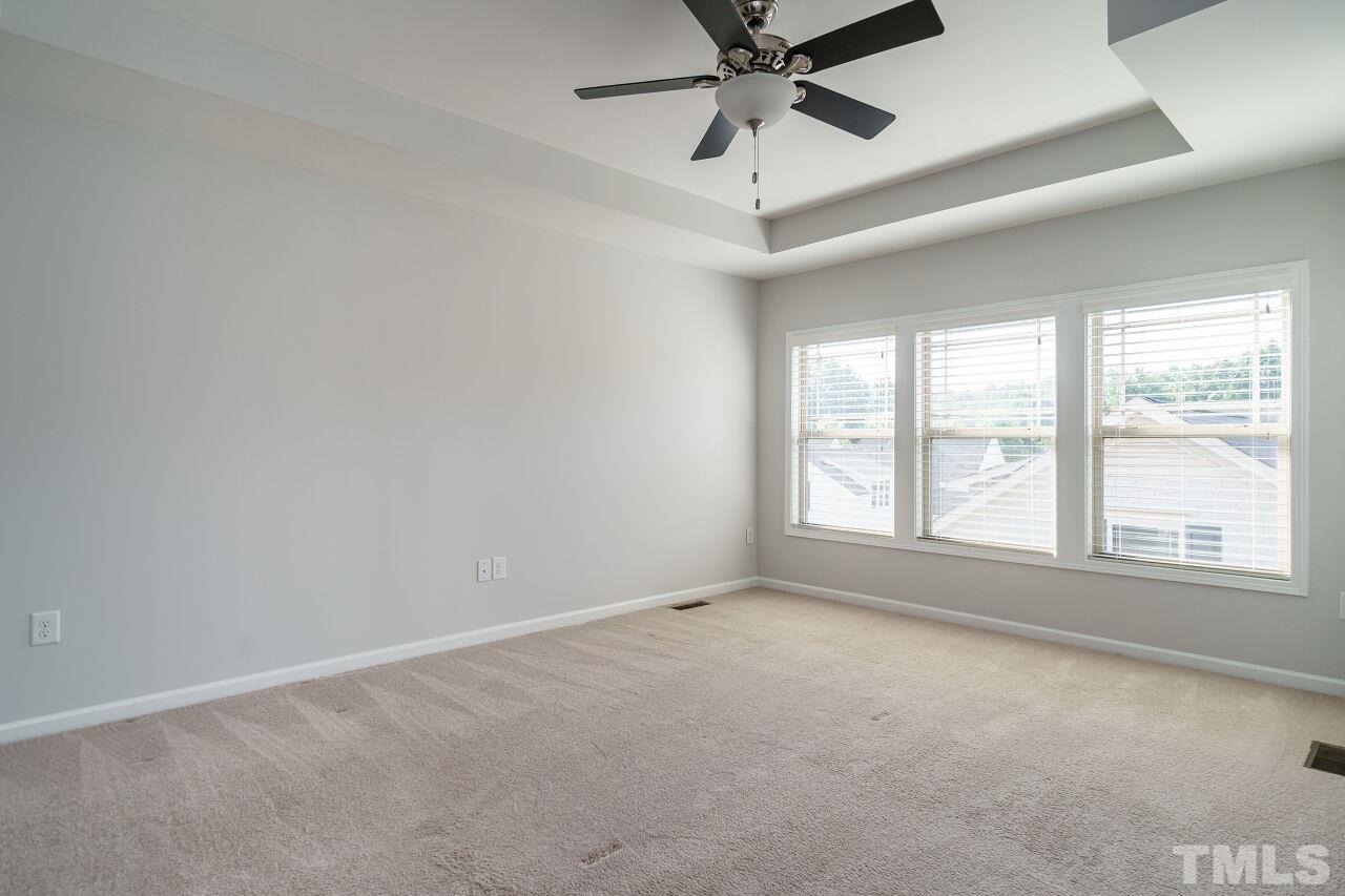 1340 Rodessa Run Raleigh, NC 27607 - Photo 16 of 28 an empty room with a window and a fan