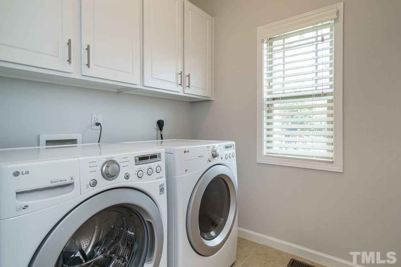 1340 Rodessa Run Raleigh, NC 27607 - Photo 23 of 28 a utility room with dryer and washer