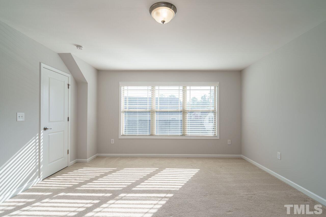 1340 Rodessa Run Raleigh, NC 27607 - Photo 25 of 28 an empty room with a empty space and windows