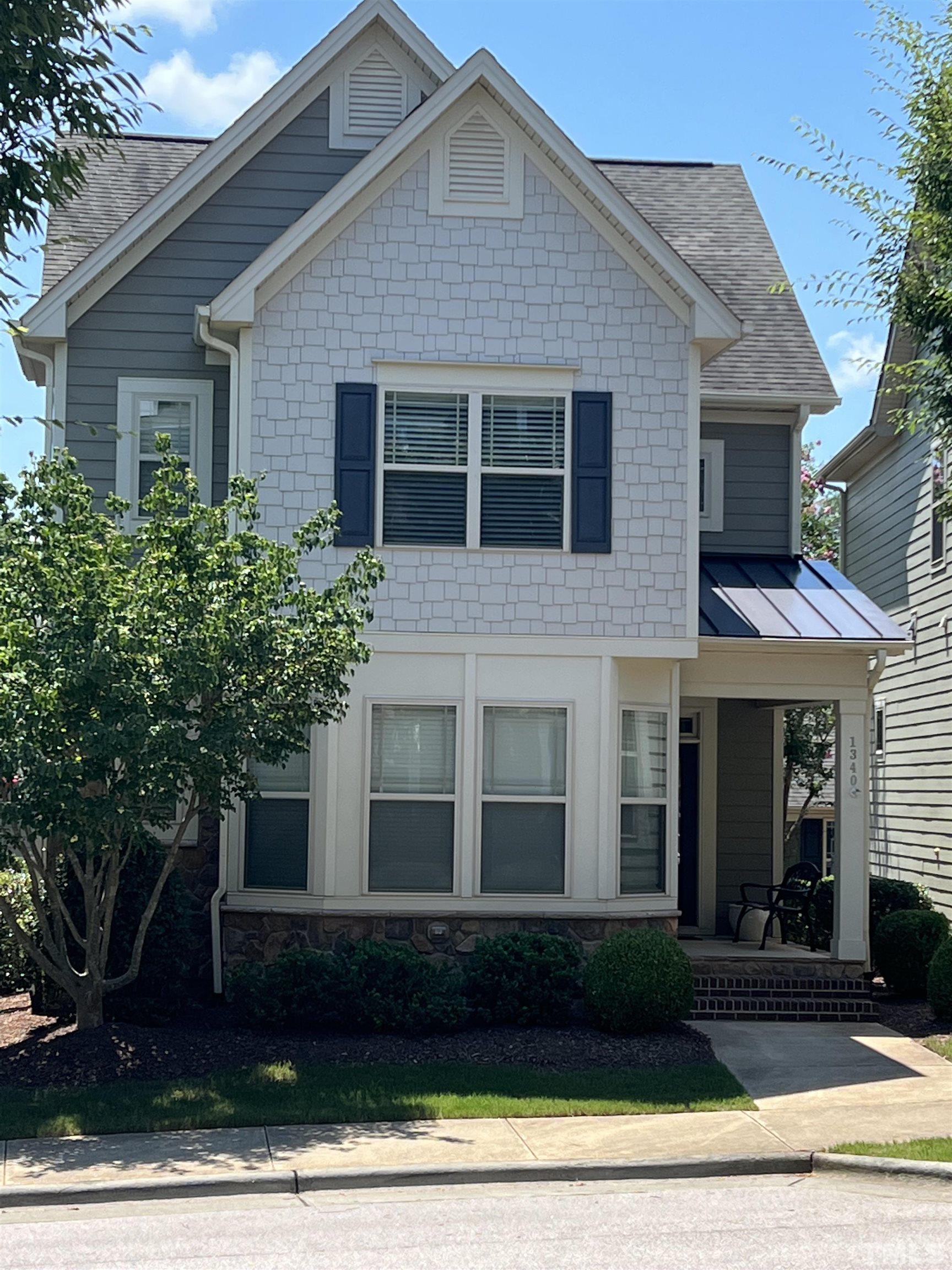 1340 Rodessa Run Raleigh, NC 27607 - Photo 3 of 28 a front view of a house with a yard