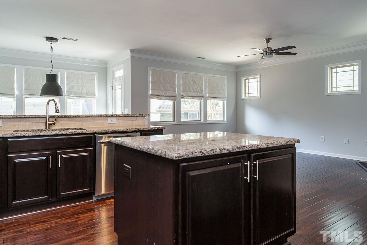 1340 Rodessa Run Raleigh, NC 27607 - Photo 8 of 28 a kitchen with granite countertop a sink and cabinets