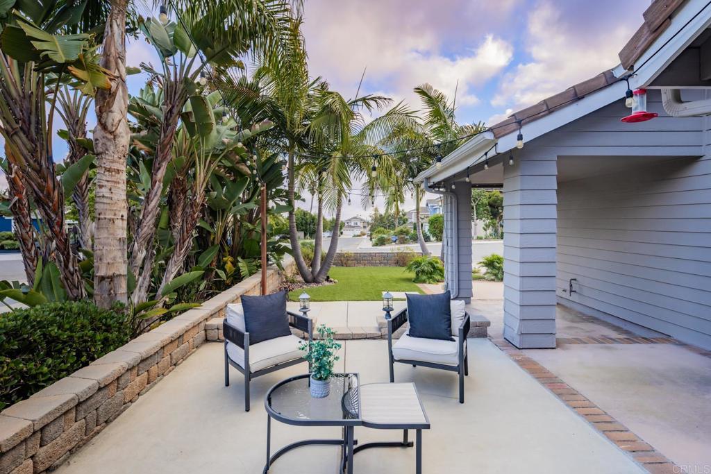 608 Crest Drive Encinitas, CA 92024 - Photo 3 of 33 a view of a patio with couches table and chairs and potted plants