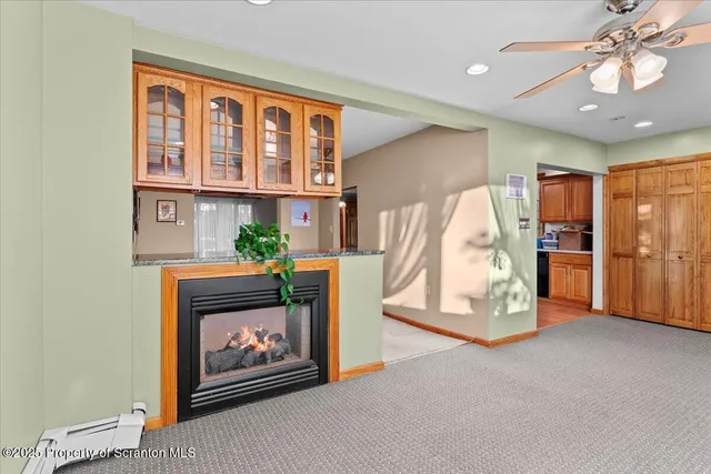 a view of an empty room with glass door