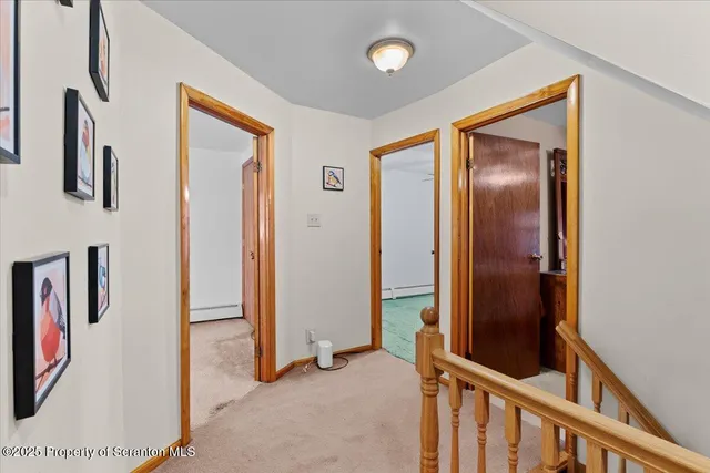 a bedroom with a bed dresser and a window