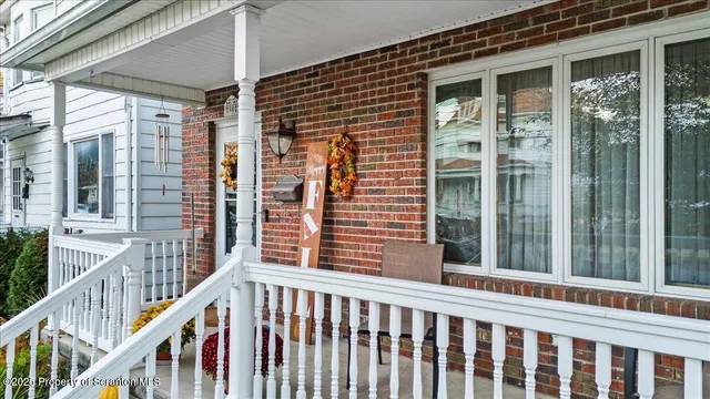 a view of a balcony with wooden floor