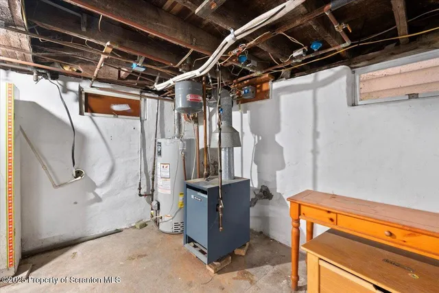 a utility room with a wooden floor washer and dryer