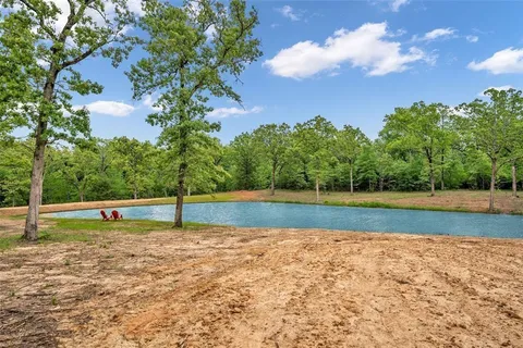 a view of a park with swings and trees