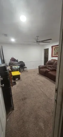 a bedroom with a bed and a lamp