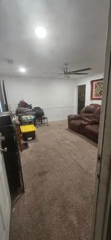 a bedroom with a bed and a lamp