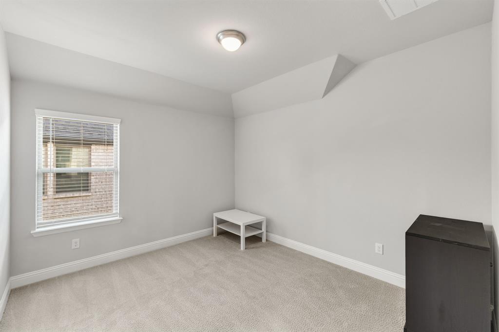 7852 Buffaloberry Road Frisco, TX 75035 - Photo 26 of 36 Room featuring light gray carpet flooring, white baseboards, and neutral wall paint