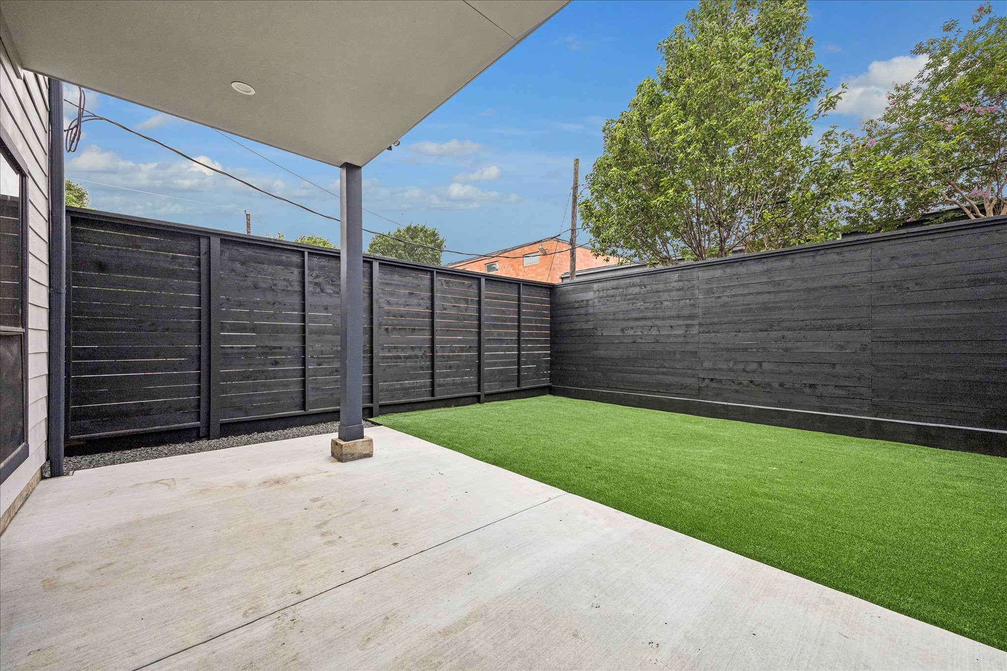 2510 Genesee Street Houston, TX 77006 - Photo 37 of 40 Backyard is features a concrete patio area new fence and new synthetic turf grass