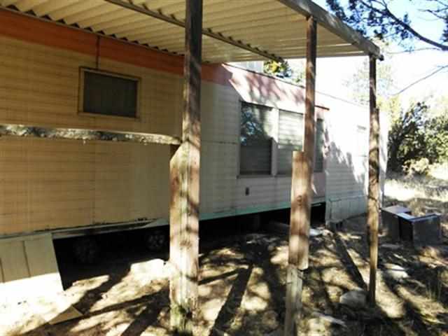 2131 Fishermans Road Overgaard, AZ 85933 - Photo 2 of 3 a front view of a house with a yard