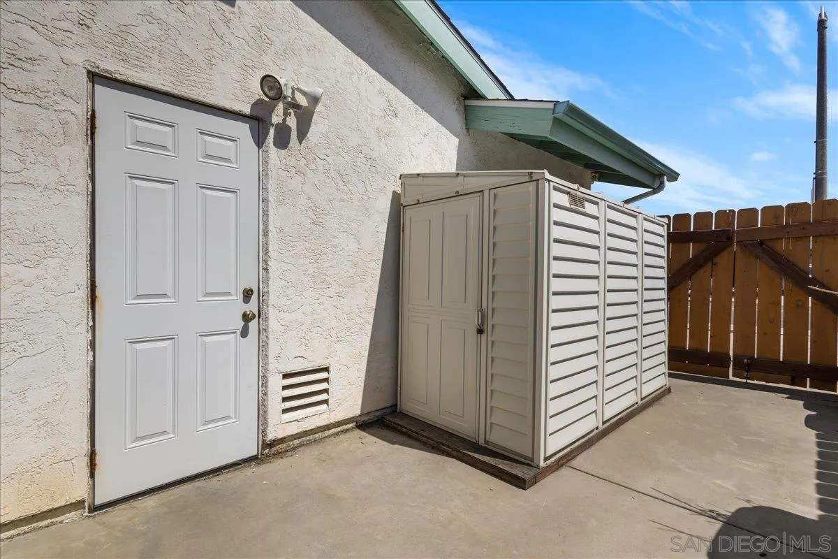 10738 2nd Street Santee, CA 92071 - Photo 31 of 52 a view of a house with backyard and wooden roof