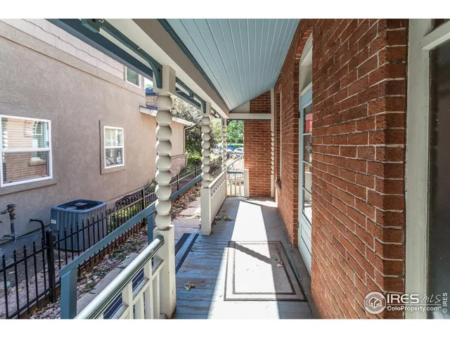 a view of a balcony with wooden floor