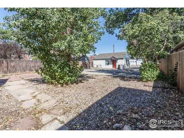 a house view with a backyard space