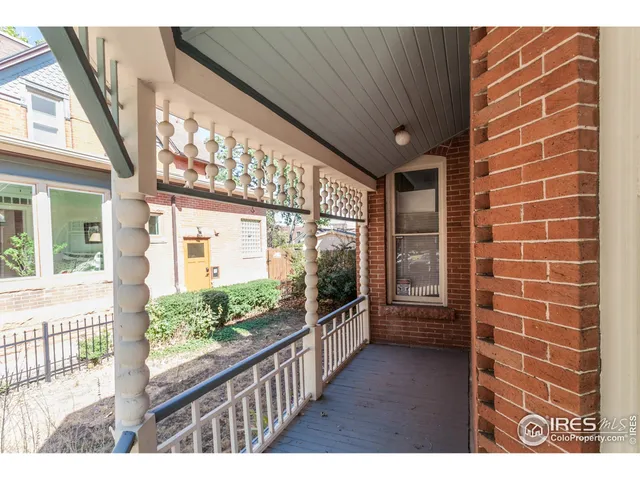a view of a porch and wooden floor