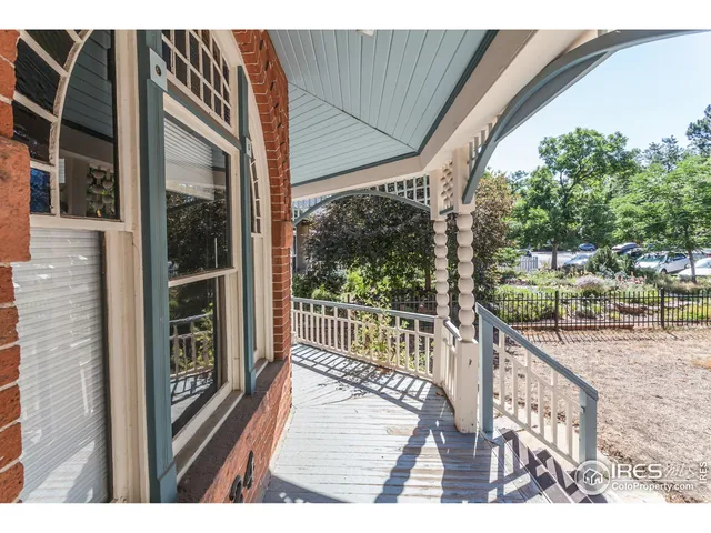 a view of a balcony with wooden floor