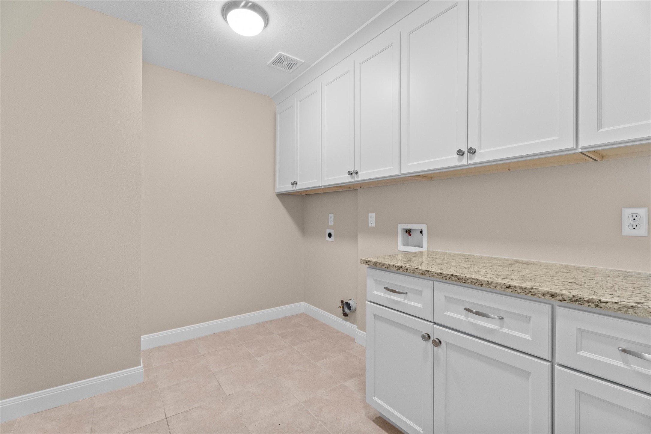 6530 Bayonne Drive Spring, TX 77389 - Photo 20 of 37 a view of cabinets with granite countertop white cabinets